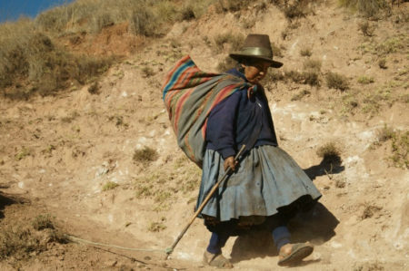 Peruvian Woman Coming Down Mountain near Moray ruins
